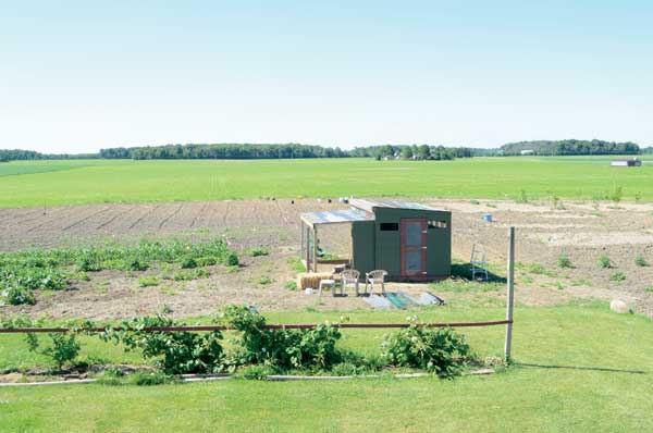 A view of the chicken mansion perched on the field of dreams that Julie and Leonard Hess call home.